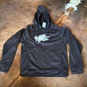Black Nike hoodie. Has thumb holes so guessing it’s a girls. size large
